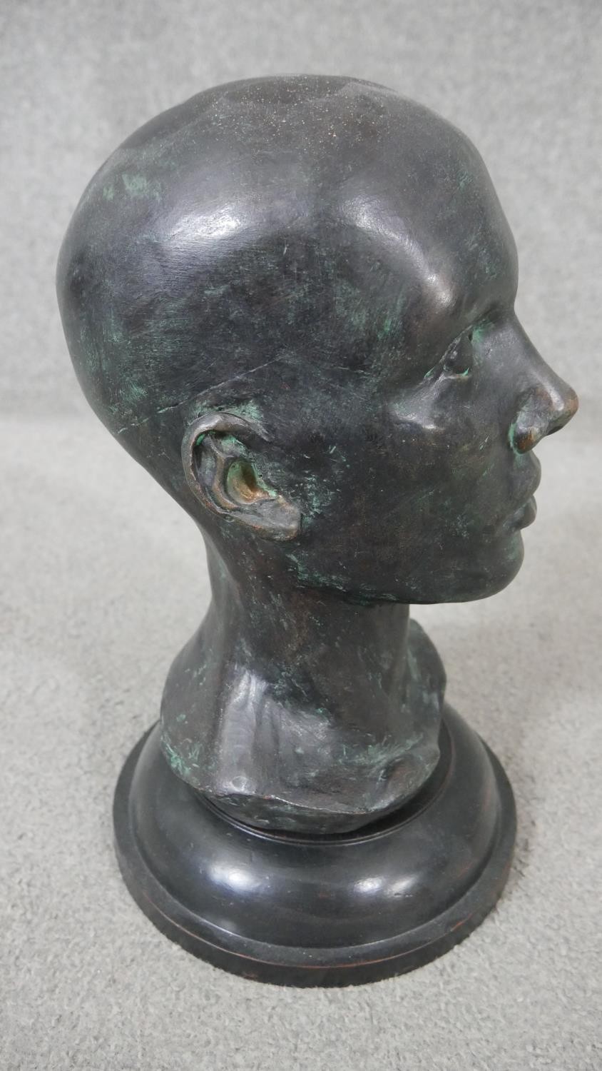 An early 20th century bronze head mounted on a turned ebonised base. H.38 W.20cm - Image 2 of 4