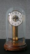 An early 20th century Maurice Favre - Boulle electric pendulum clock, in a glass and mahogany