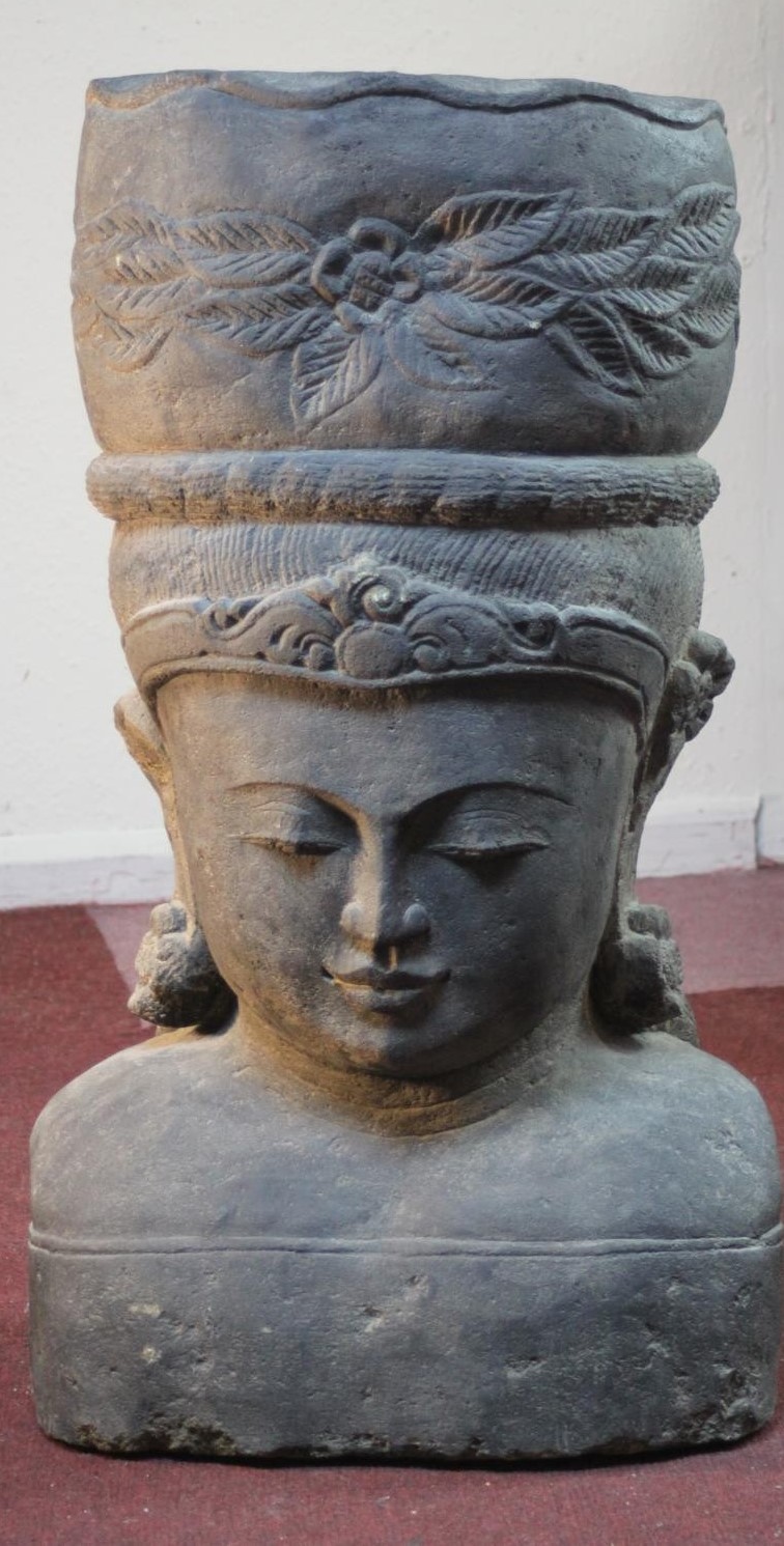 A very large 20th century Balinese Goddess carved stone head planter. H.92 W.48cm.