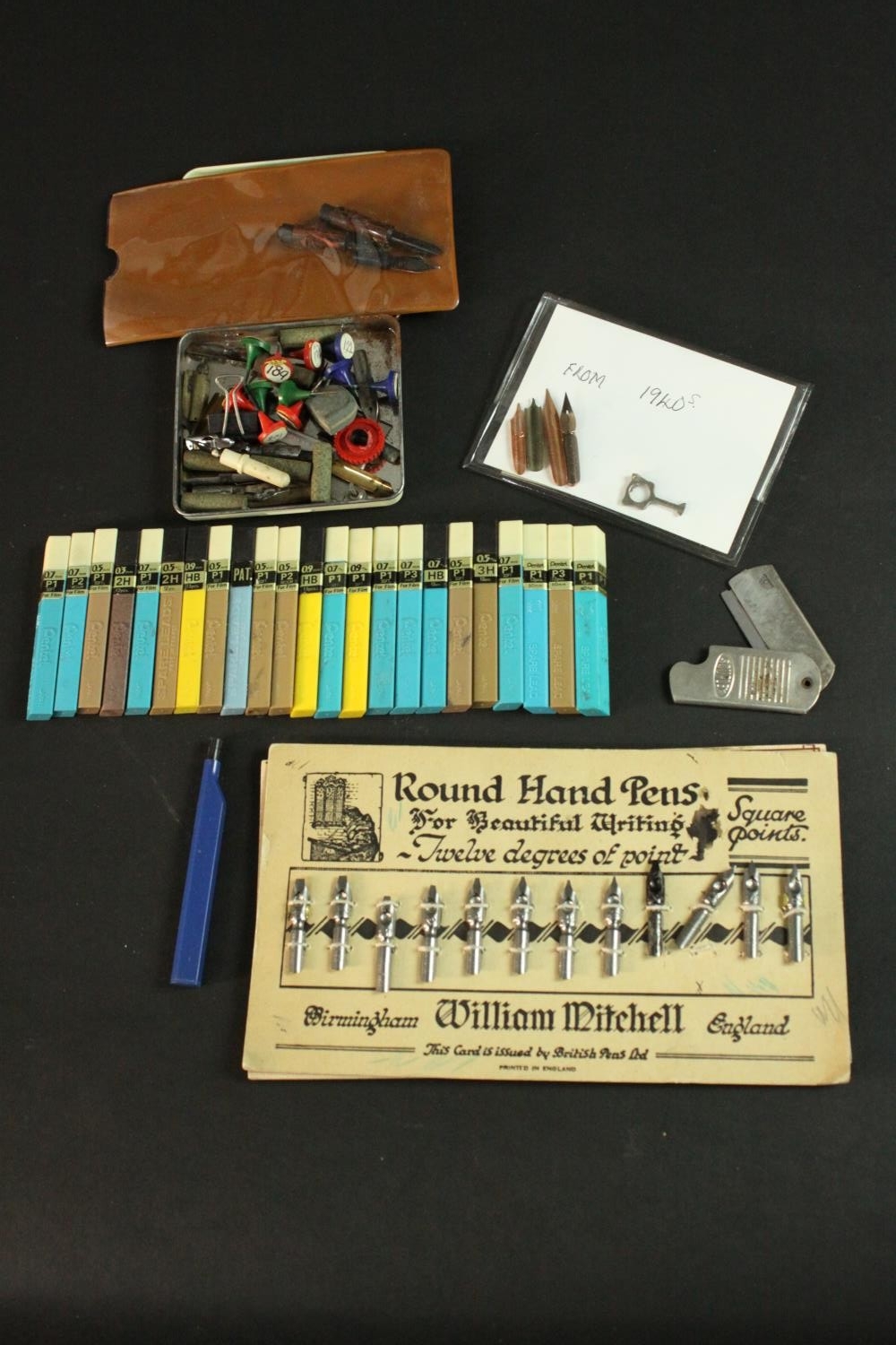 A collection of vintage pen nibs and drawing leads, including vintage William Mitchell Round Hand