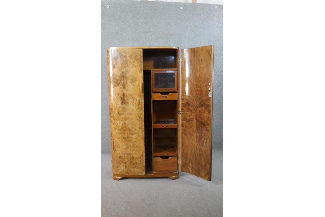 An Art Deco figured walnut compactum wardrobe, with two quarter veneered doors, the fitted - Image 2 of 13
