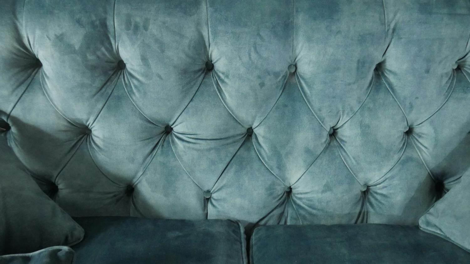 A contemporary Victorian style sofa, upholstered in blue velour, with a buttoned back, on turned bun - Image 3 of 3