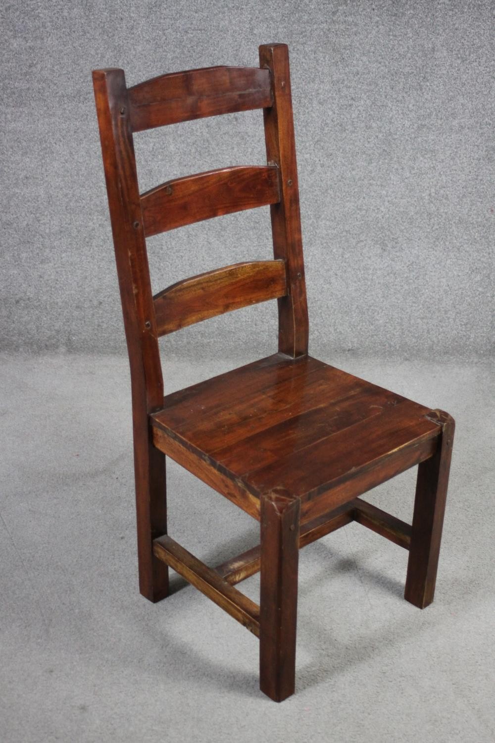 A set of eight mango wood ladder back dining chairs, the legs joined by H stretchers. - Image 6 of 11