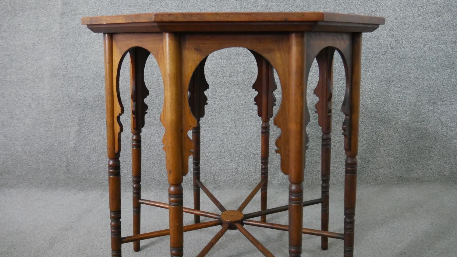 A circa 1900 Liberty & Co Anglo-Mooresque octagonal table, the top with yellow tiles, on eight - Image 5 of 8
