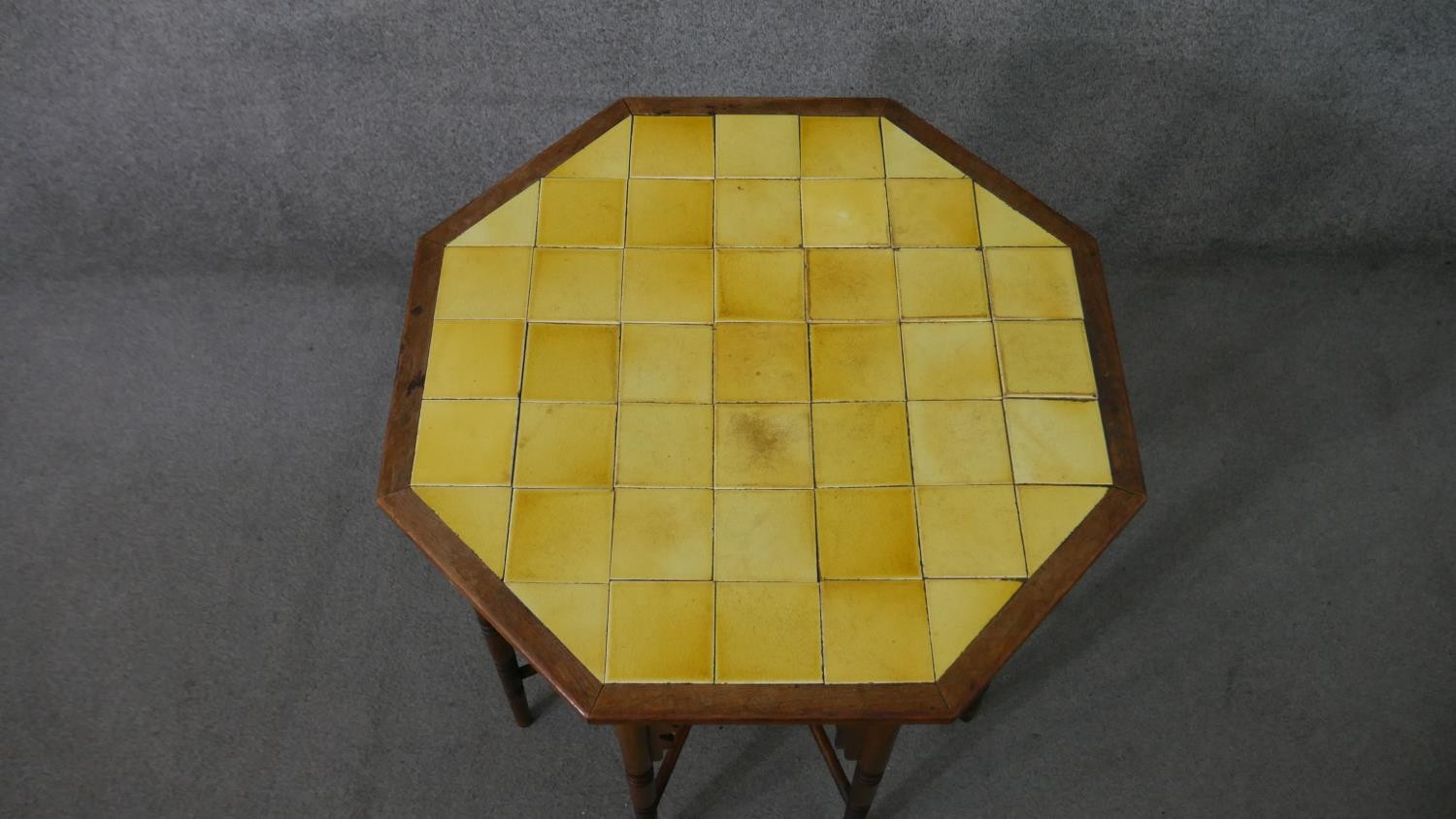 A circa 1900 Liberty & Co Anglo-Mooresque octagonal table, the top with yellow tiles, on eight - Image 3 of 8