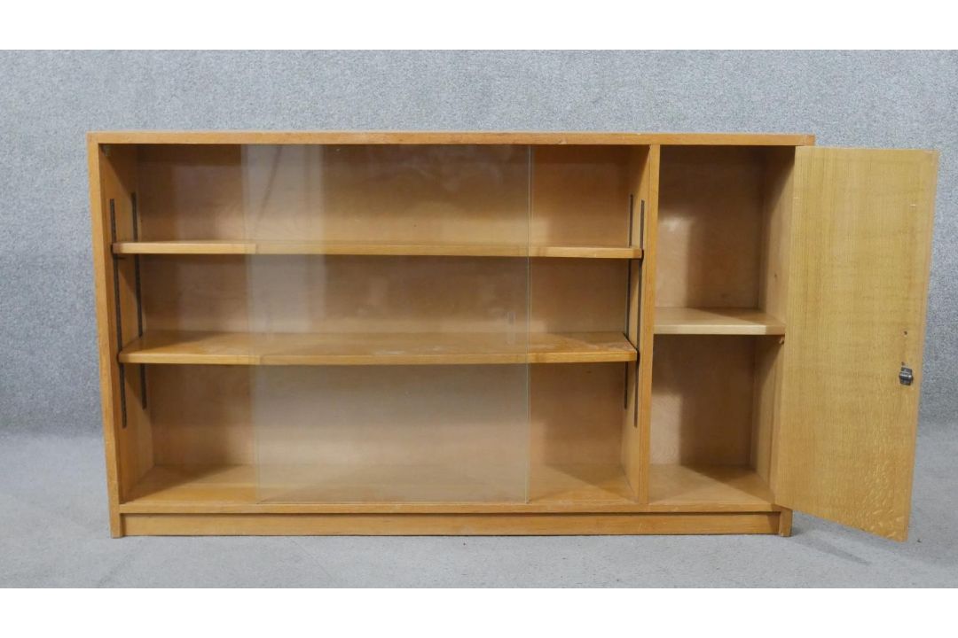 A 1960s light oak glazed Criterion bookcase, with two glass sliding doors enclosing shelves, one - Image 2 of 6