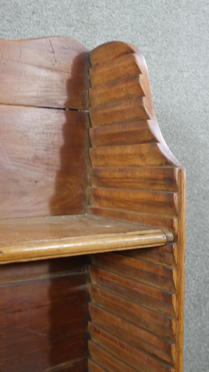 A George III pine waterfall style bookcase, with a shaped top, over four adjustable shelves, on - Image 6 of 8