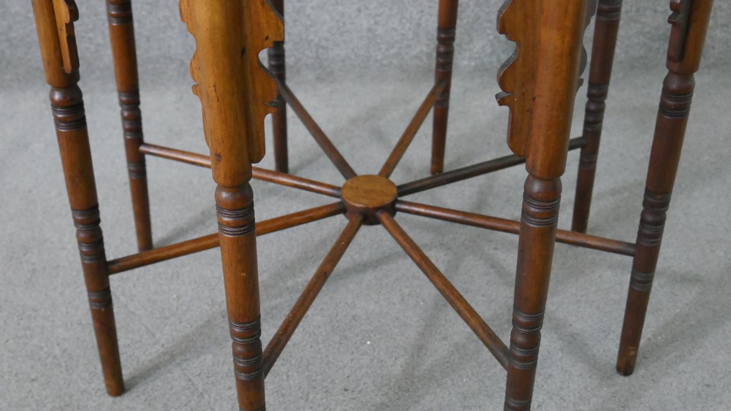 A circa 1900 Liberty & Co Anglo-Mooresque octagonal table, the top with yellow tiles, on eight - Image 7 of 8