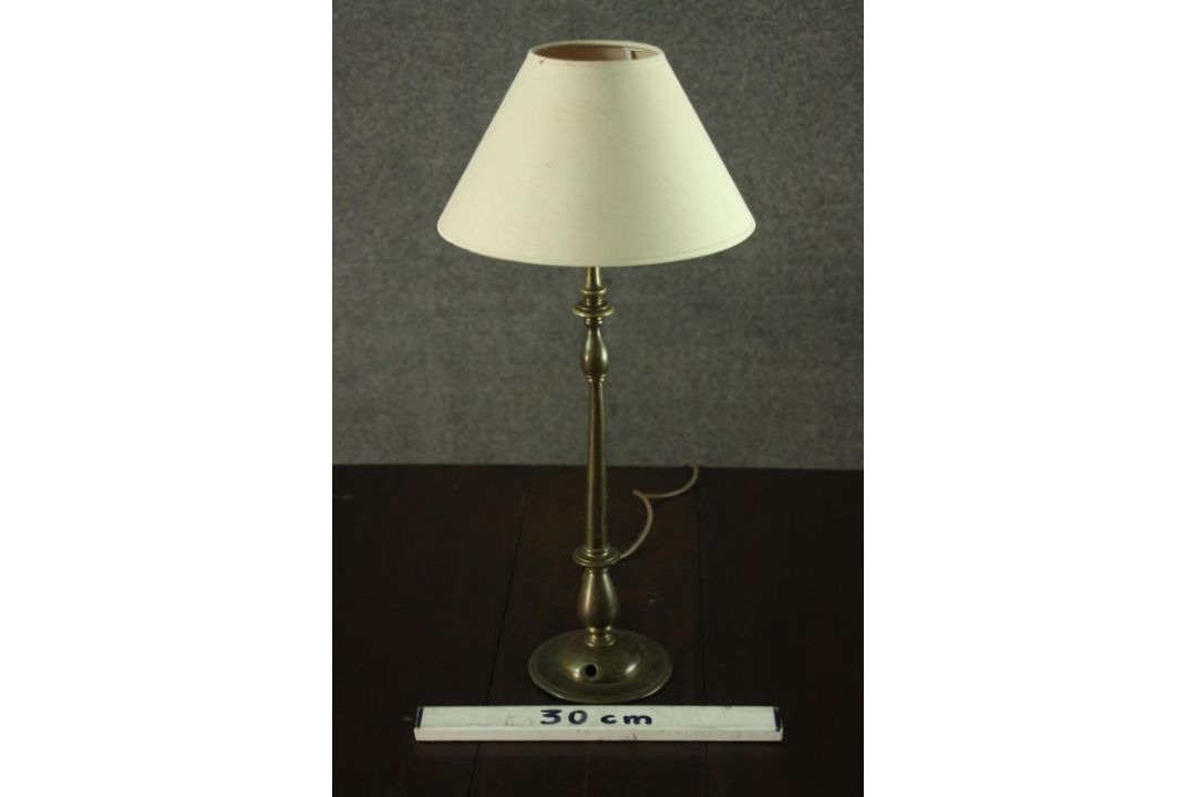 A turned brass table lamp, with an ivory coloured shade. H.56 W.25cm. - Image 2 of 4