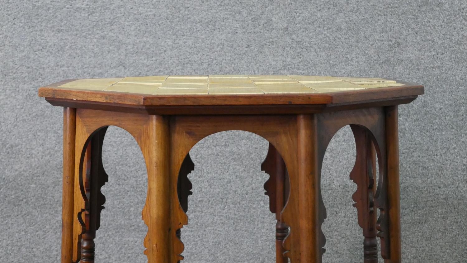 A circa 1900 Liberty & Co Anglo-Mooresque octagonal table, the top with yellow tiles, on eight - Image 2 of 8