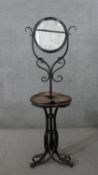 A late 19th century Thonet style bentwood dressing stand, with a circular adjustable mirror, on