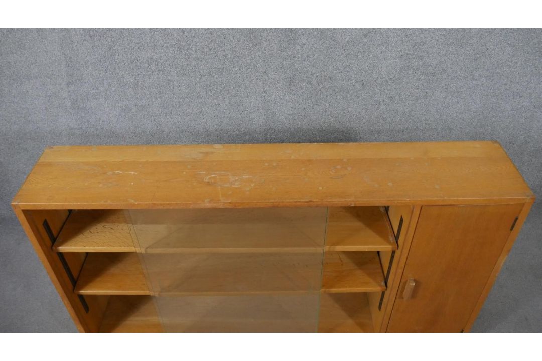 A 1960s light oak glazed Criterion bookcase, with two glass sliding doors enclosing shelves, one - Image 3 of 6