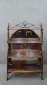 A late 19th/early 20th century Thonet style waterfall bookcase, the bentwood scrolling gallery