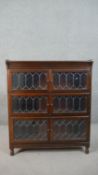 A 20th century Minty of Oxford three tier stacking bookcase, each tier with two leaded glass