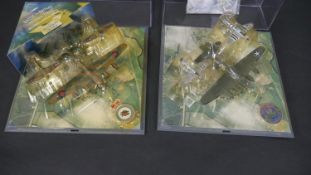 A Corgi perspex cased set, B17-Sally B, Mustang and Thunderbolt along with a Corgi perspex cased
