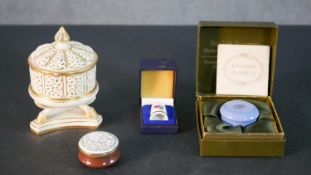 A collection of trinket boxes including, a pierced porcelain and hand gilded Oriental design