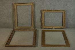 A collection of four large picture frames, including two carved giltwood and gesso frames with