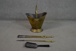 A Victorian brass coal bucket, with a swing handle, together with Victorian brass tongs and poker,