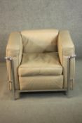 Manner of Le Corbusier, Charlotte Perriand and Pierre Jeanneret, a LC2 style armchair, upholstered