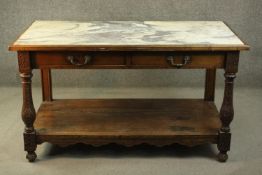 A 19th century French chestnut wash stand, the rectangular top set with white marble, over two short