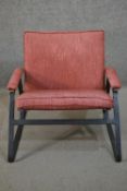 A pair of mid to late 20th century armchairs, purchased from Heal's, with a steel frame, upholstered