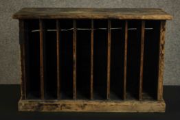 A rustic painted pine music cabinet, with multiple dividers and on a plinth base. H.46 W.70 D.32cm.