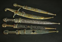 A collection of five 20th century Armenian daggers. The silver plated and brass scabbards with