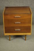 A circa 1960s Stag Furniture teak bedside chest, with a three quarter gallery over three long