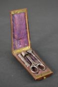 A mahogany and marquetry Victorian sewing kit with silver thimble, steel scissors, white metal