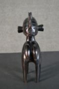 An African carved Tribal figure. H.26 W.8 D.12cm