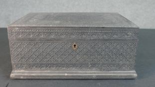 A 19th century Anglo-Indian carved box with stylised floral and geometric design. H.14.5 W.35 D.26cm