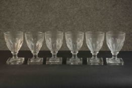 A set of six early 20th century hand cut petal faceted glass rummers with square bases. H.13.5 Dia.