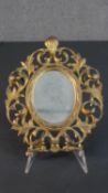 A Victorian gilt spelter pierced scrolling foliate design wall mirror. H..27 W.22cm