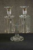 A hand cut two branch crystal candelabra lustre with crystal drops and floral design candle holders.