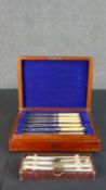 A canteen of fish knives for four people with engraved silver plated blades along with a box of