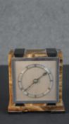 An Art Deco onyx and marble mantle clock with chrome face. H.14 W.12 D.7cm
