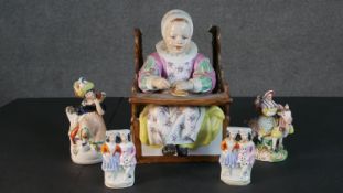 A collection of 19th century Staffordshire pottery figures. A pair of flat back figures of a