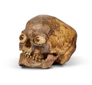 A CAST OF A MICROCEPHALUS HUMAN SKULL
