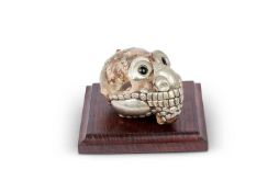 A TIBETIAN KAPALA MONKEY SKULL (RHESUS MACAQUE)