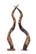 A PAIR OF CARVED KUDO HORNS