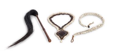 TRIBAL: AN AFRICAN NECKLACE, BELT AND WHIP