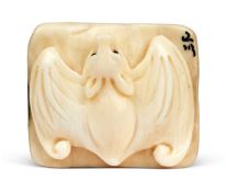 A FOSSILISED MAMMOTH TUSK NETSUKE MODELLED AS A BAT