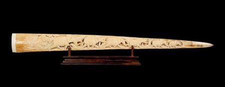 A CARVED SWORDFISH (XIPHIAS GLADIUS) BILL ON WOODEN DISPLAY STAND