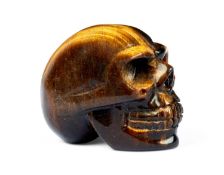 A TIGER'S EYE MODEL OF A HUMAN SKULL