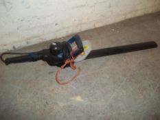 AN ELECTRIC HEDGE TRIMMER