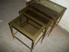 A BRASS NEST OF TABLES