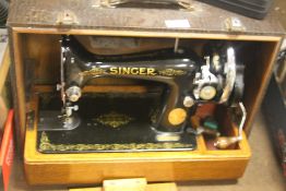 A CASED SINGER SEWING MACHINE