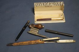 AN UNUSUAL COMBINATION, INKWELL/PEN/PENCIL SET IN THE FORM OF A PISTOL, TWO QUIL KNIFE LETTER
