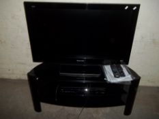 A PANASONIC TV TOGETHER WITH STAND AND A DVD PLAYER