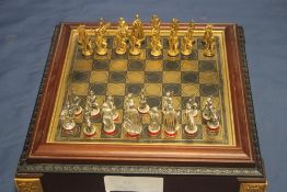 A METAL CHESS SET IN FITTED CASE